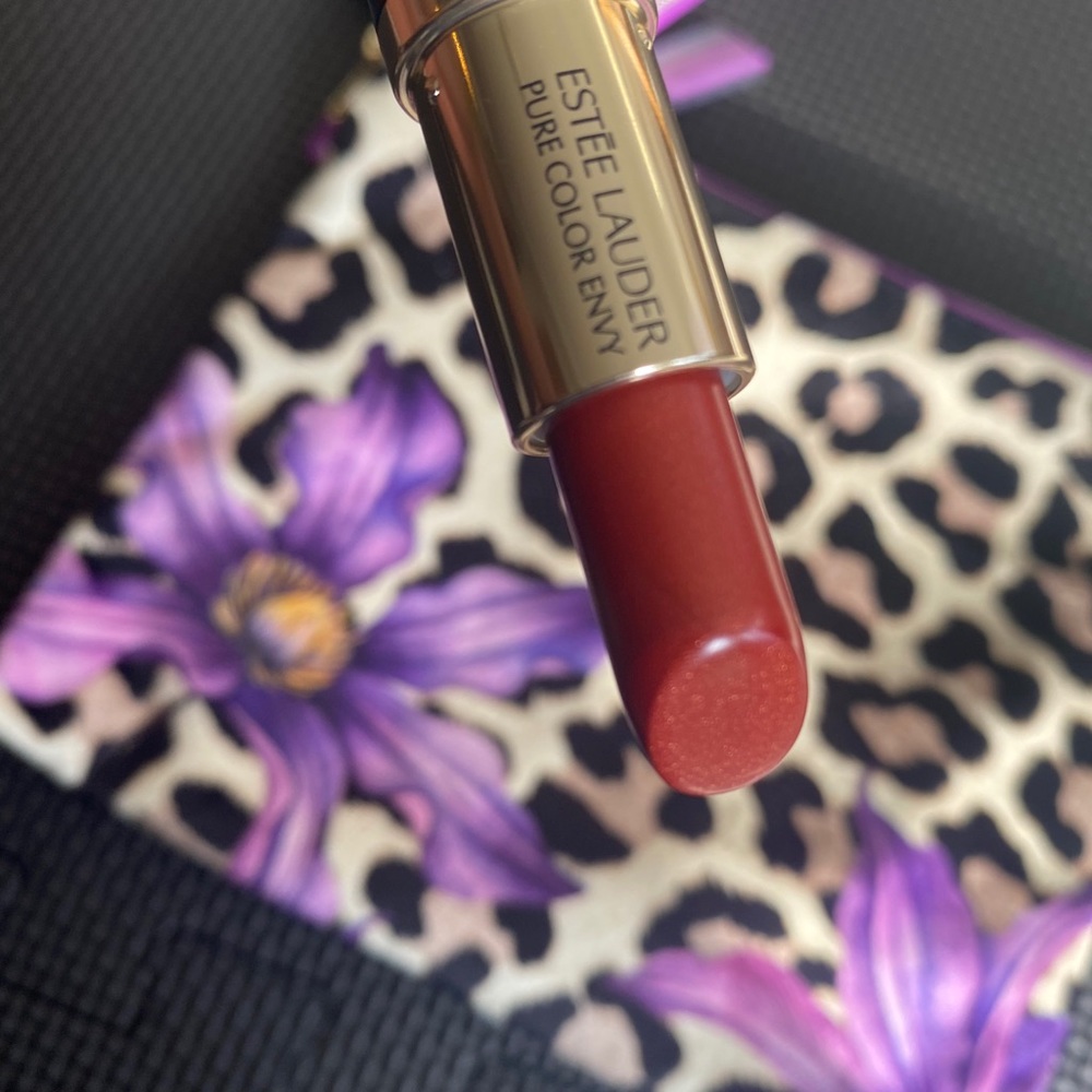 Estée Lauder lipstick and makeup bags